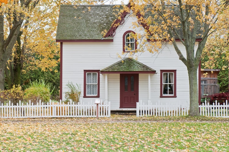 radon-resistant white house under a maple tree